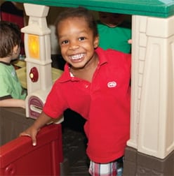 Child in playhouse