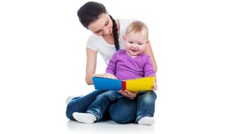 mother reading to baby