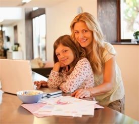 Mom and daughter by laptop